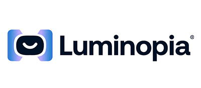 Luminopia-scaled Luminopia logo featuring a stylized blue icon resembling VR goggles with a smile and the word Luminopia in bold black text to the right.